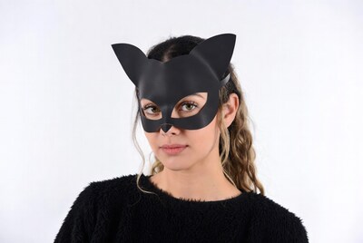 Woman wearing black cat mask