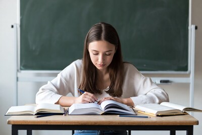 Young woman studying at desk