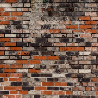 Old brick wall with damaged bricks
