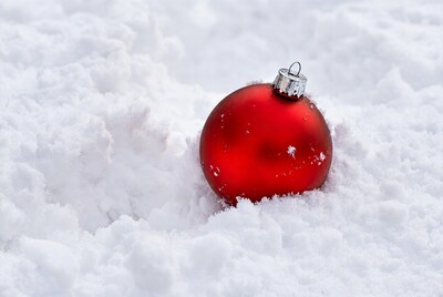 Red Christmas ornament in snow