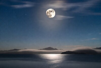 Full moon over misty mountains