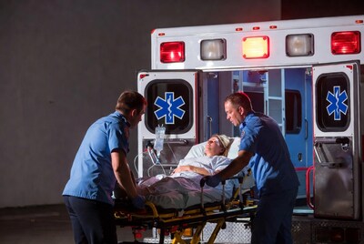 Paramedics loading patient into ambulance