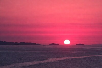 Sunset over ocean with islands