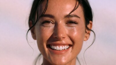 Smiling woman with wet face