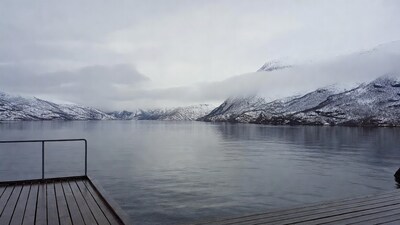 Snowy mountains over calm lake