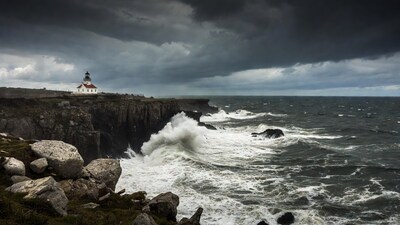 Lighthouse on Rocky Cliff with Stormy Waves