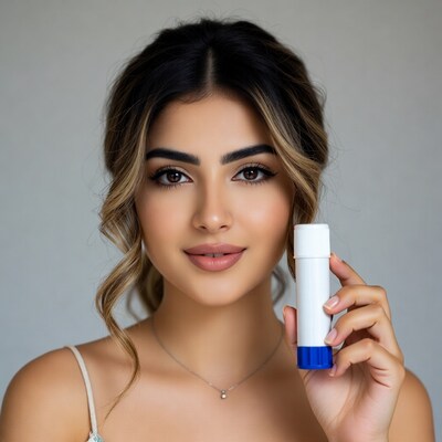 Woman holding white and blue tube