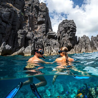 Couple snorkeling in clear water