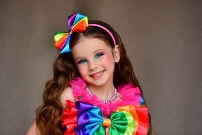 Girl with rainbow bow