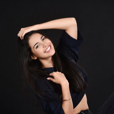 Young woman smiling in studio