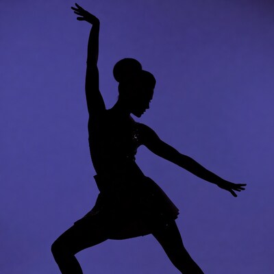 Ballerina silhouette on purple background