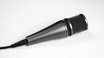 Black studio microphone on white background