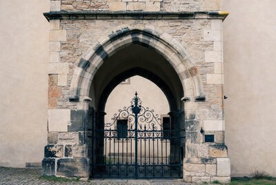 Stone Archway with Ornate Gate
