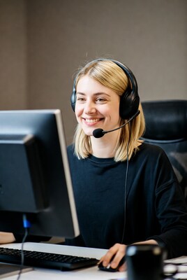 Woman with headset at computer
