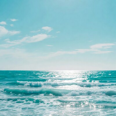 Turquoise ocean waves under blue sky