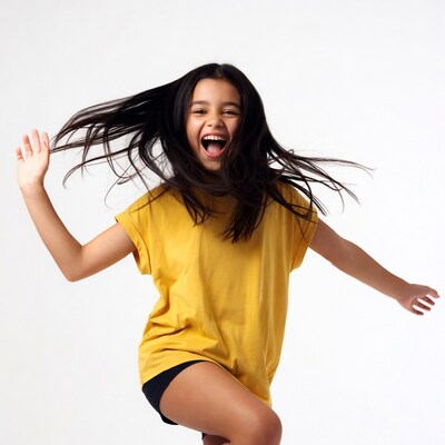 Girl in yellow shirt jumping excitedly