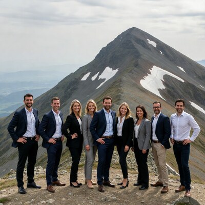 Business team on mountain summit