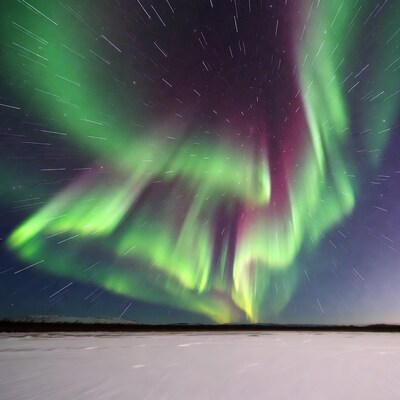 Northern Lights Over Snowy Landscape