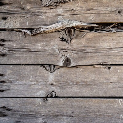 Weathered wooden planks with cracks