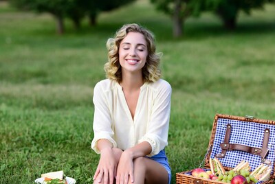 Woman enjoying picnic in park