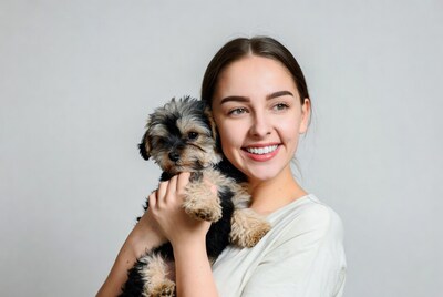 Woman holding small dog