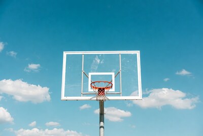 Basketball hoop against blue sky