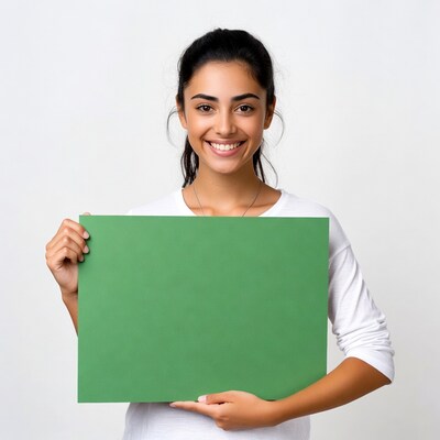 Woman holding green sign