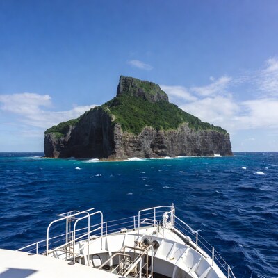 Boat approaching rocky island