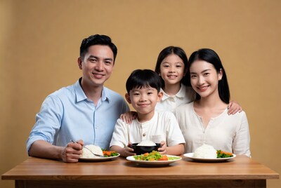Asian family enjoying meal together