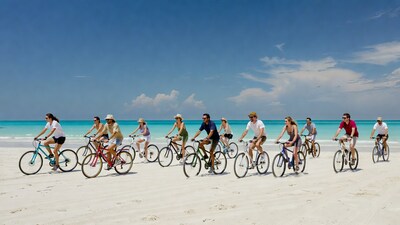 Group biking on tropical beach