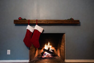 Christmas stockings hanging by fireplace