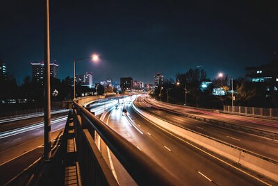 Night highway with light trails