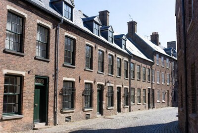 Historic brick buildings on cobblestone street