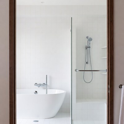 Modern white bathroom with freestanding tub