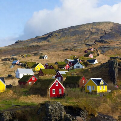 Colorful houses on grassy hillside