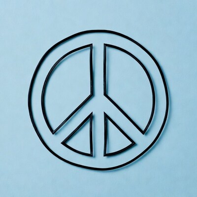 Black peace sign on blue background