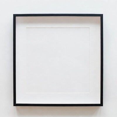 Empty black picture frame on wall