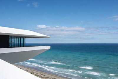 Modern white house overlooking ocean