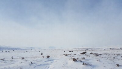 Snowy landscape with distant hills