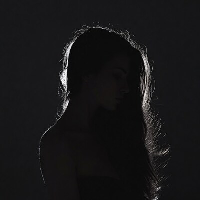 Silhouette of woman with long hair