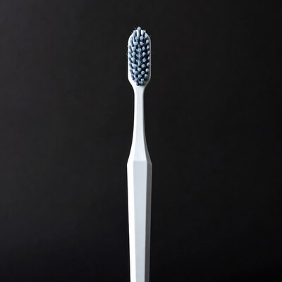 White toothbrush with blue bristles