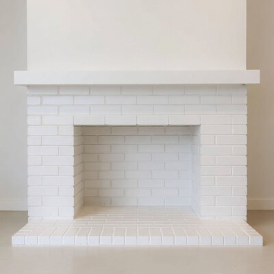 White brick fireplace in room