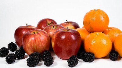 Fresh apples oranges and blackberries