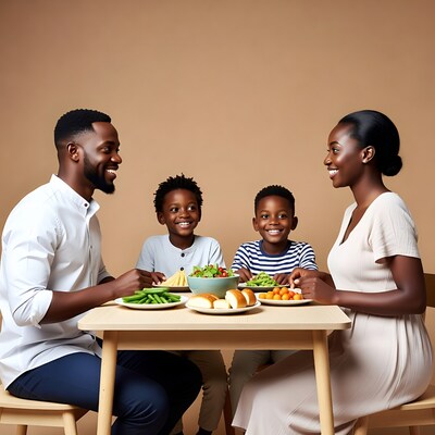 Happy African family eating dinner