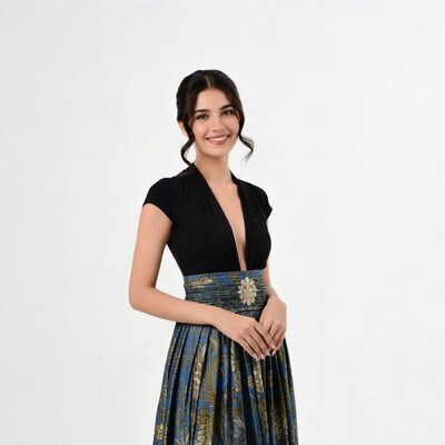 Woman in black top and patterned skirt