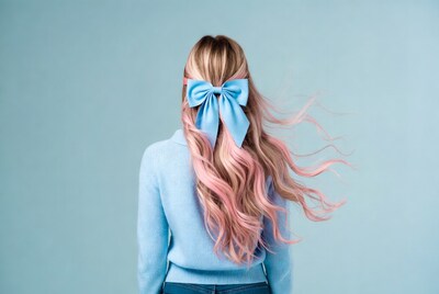 Woman with pink hair and blue bow