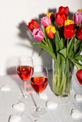 Wine glasses with tulips bouquet