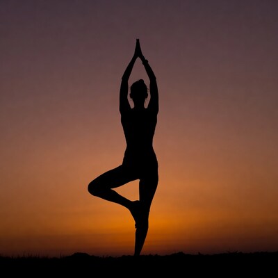 Woman in yoga tree pose