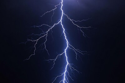Bright lightning bolt in dark sky