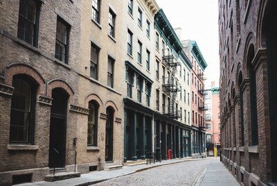 Historic brick buildings on cobblestone street